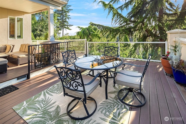 wooden deck with an outdoor hangout area