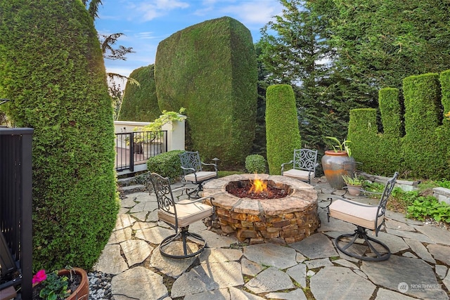 view of patio / terrace featuring a fire pit