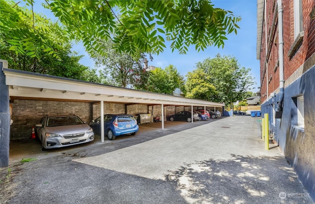 view of vehicle parking with a carport