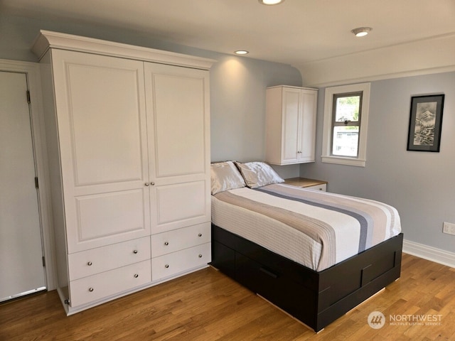 bedroom featuring hardwood / wood-style flooring