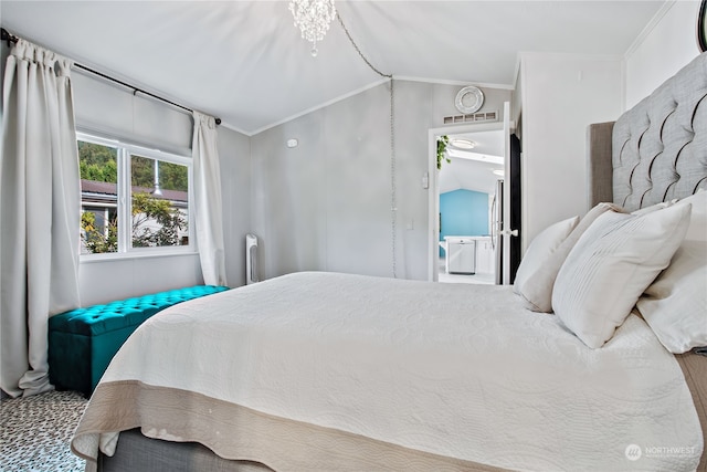 bedroom with vaulted ceiling, crown molding, and visible vents