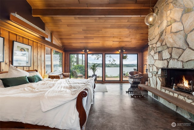 bedroom featuring a water view, wooden walls, vaulted ceiling with beams, a fireplace, and wood ceiling