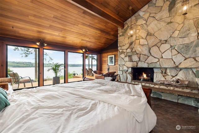 unfurnished bedroom with wooden ceiling, a stone fireplace, lofted ceiling, access to outside, and a water view