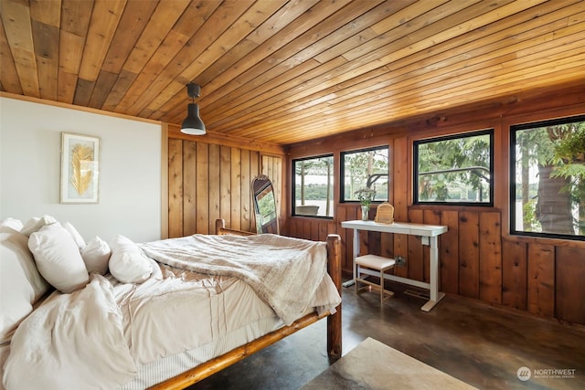 bedroom with wooden walls and wooden ceiling