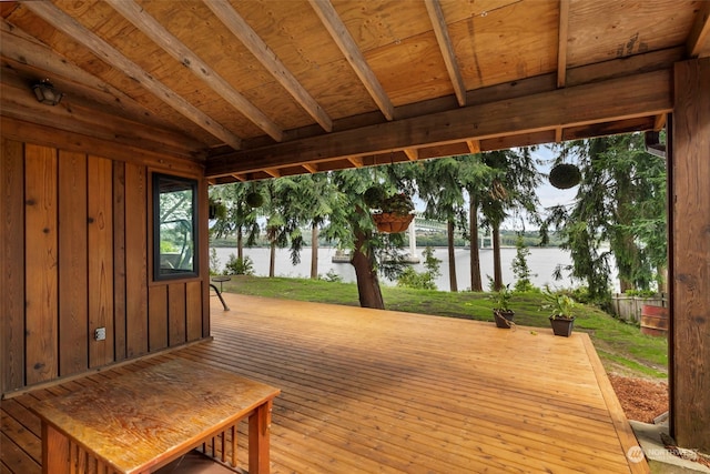 wooden deck featuring a water view