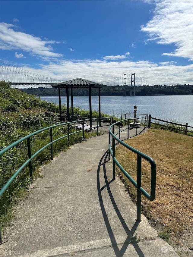 view of community with a water view