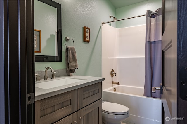 full bathroom with shower / bath combo with shower curtain, toilet, and vanity