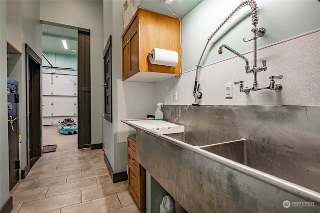 interior space with tile patterned floors and vanity