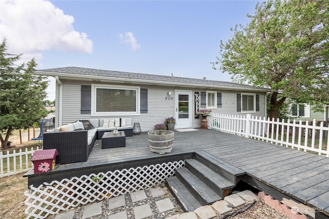 wooden deck with an outdoor living space