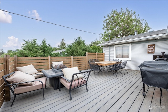 deck featuring an outdoor hangout area and area for grilling