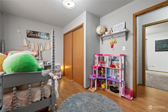 bedroom with a closet and light wood-type flooring