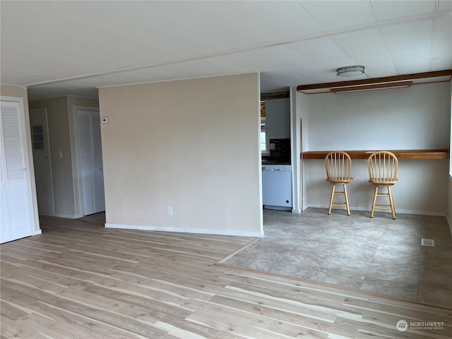 spare room with light wood-type flooring