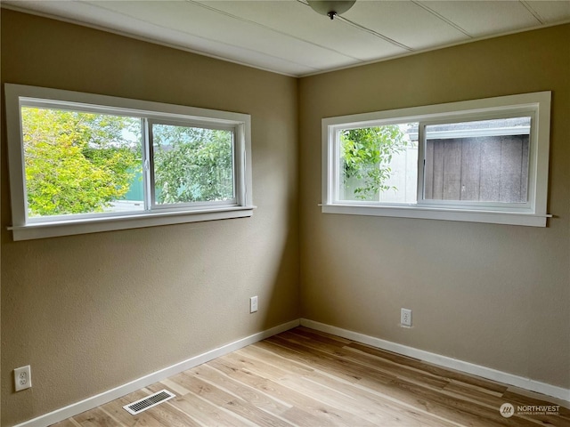 unfurnished room featuring light wood-type flooring