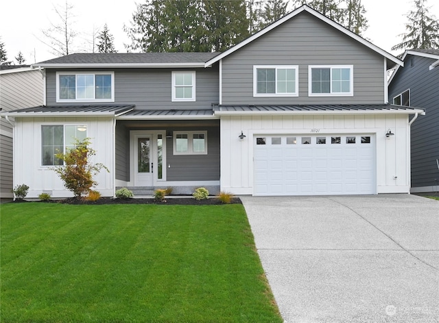 view of property with a front yard and a garage