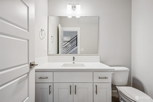 bathroom with vanity and toilet