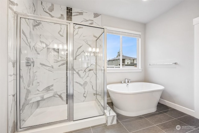 bathroom featuring tile patterned flooring and independent shower and bath