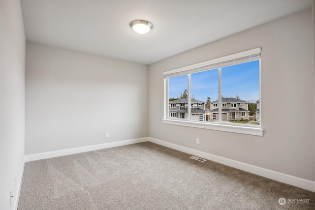 unfurnished room featuring carpet floors