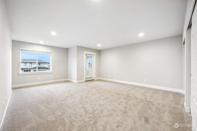 empty room with light colored carpet