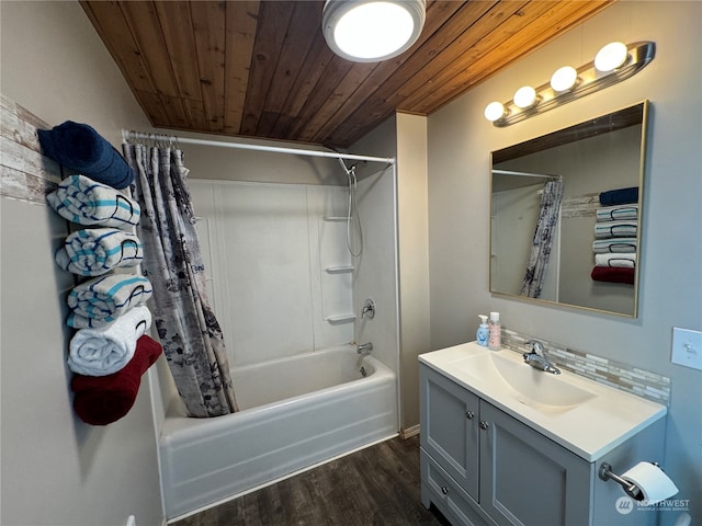 bathroom featuring hardwood / wood-style flooring, vanity, shower / bath combo with shower curtain, and wooden ceiling