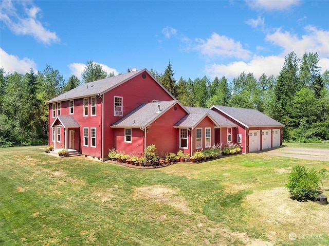 view of front of house featuring a garage and a front yard