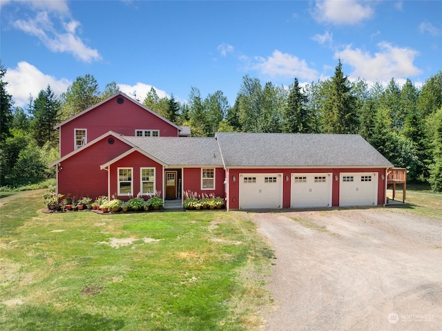 view of front of home featuring a garage and a front lawn