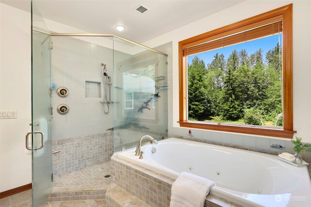 bathroom with separate shower and tub