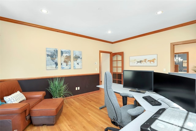 office with light wood-type flooring and ornamental molding