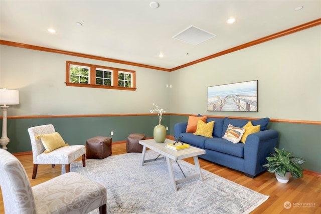 living room featuring hardwood / wood-style floors and ornamental molding