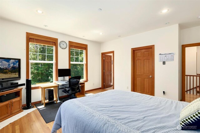 bedroom with wood-type flooring