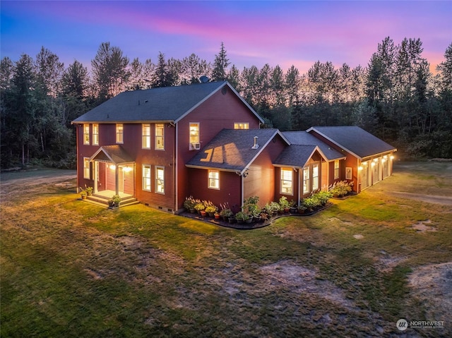 view of front of house with a yard