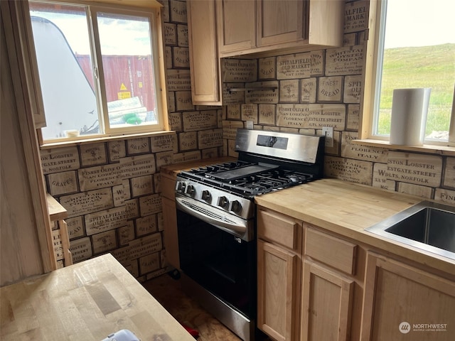 kitchen with wood counters and stainless steel gas stove