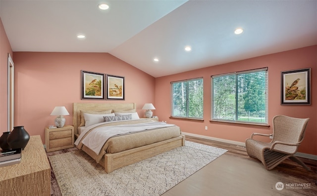 bedroom with baseboards, lofted ceiling, wood finished floors, and recessed lighting