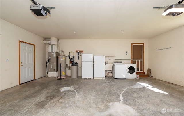 garage featuring freestanding refrigerator, heating unit, washer / clothes dryer, and a garage door opener