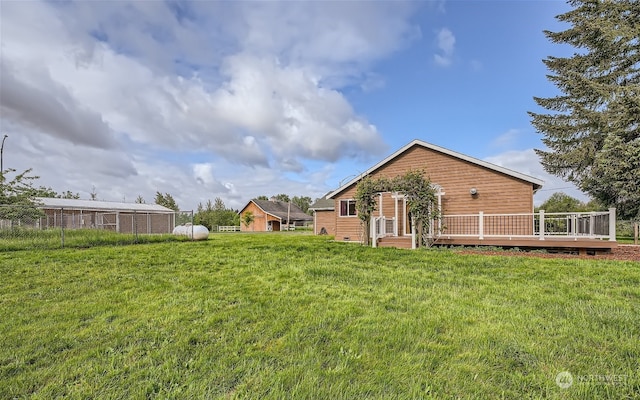 view of yard with a wooden deck