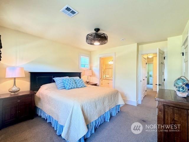 bedroom with light colored carpet