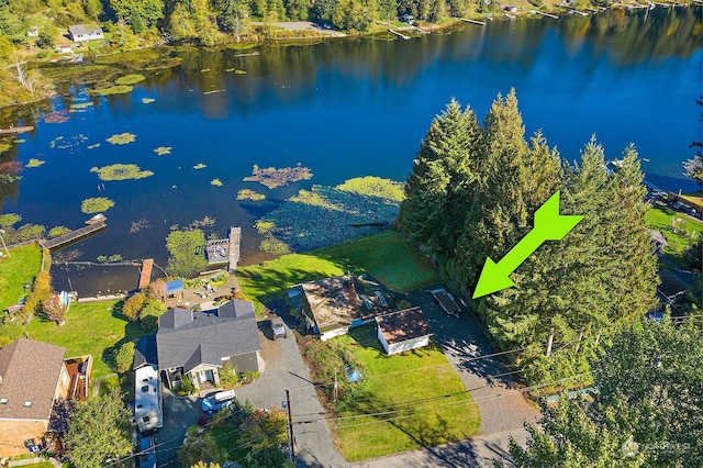 birds eye view of property with a water view