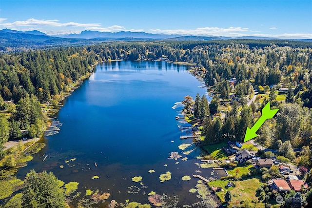 aerial view featuring a water and mountain view