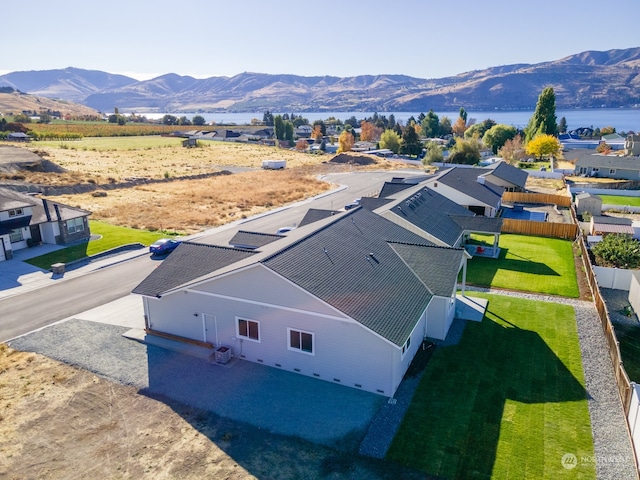 bird's eye view featuring a water and mountain view