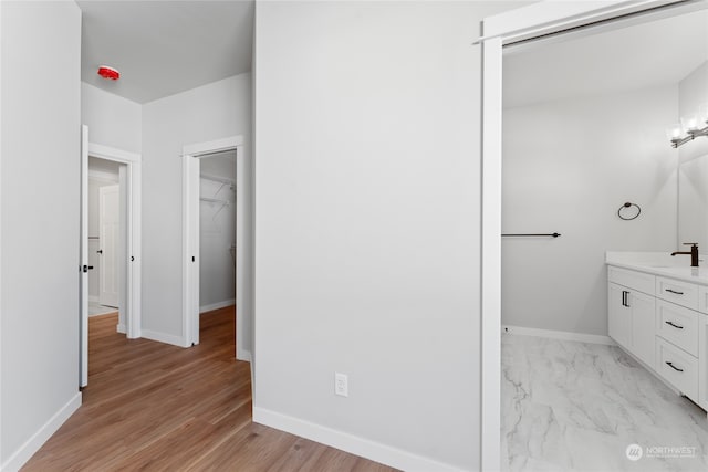 bathroom featuring vanity and hardwood / wood-style floors