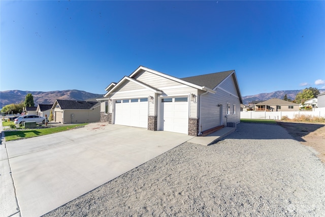 view of front of house with a mountain view and a garage