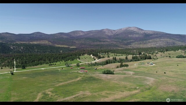 mountain view featuring a rural view