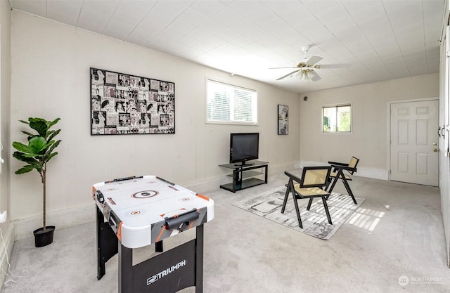 rec room featuring ceiling fan and carpet floors