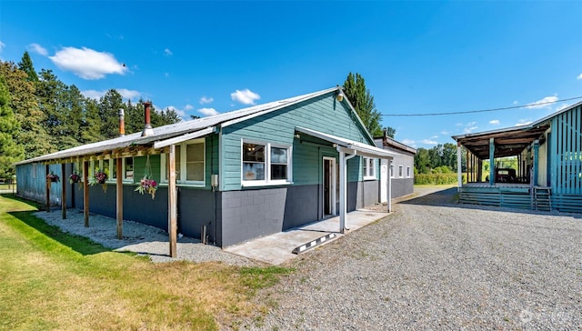 view of property exterior with a yard