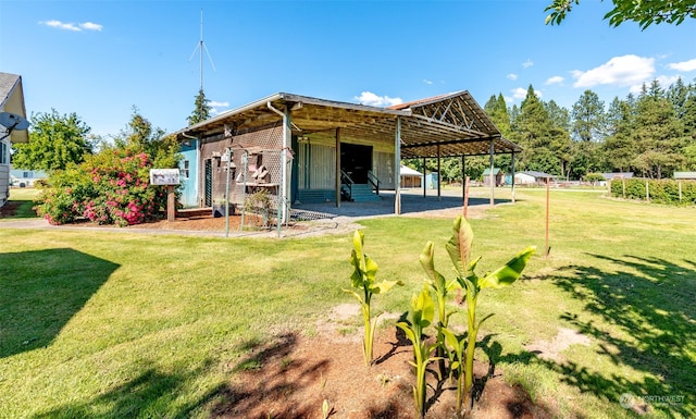 back of property featuring a yard and a patio area