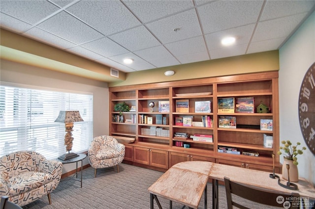 office area featuring a paneled ceiling and carpet floors