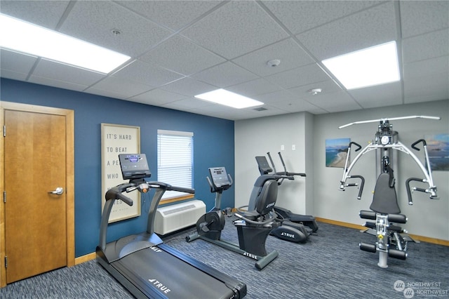 workout area with carpet and a drop ceiling