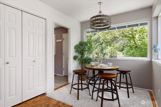 dining room with an inviting chandelier and hardwood / wood-style floors