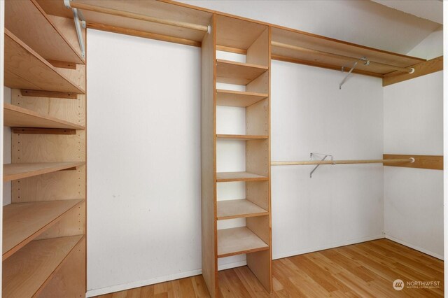 walk in closet featuring light hardwood / wood-style floors