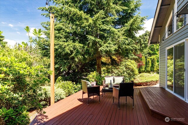 wooden deck featuring an outdoor hangout area