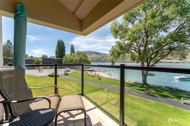 balcony with a water and mountain view